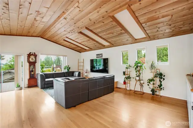 At the top of the stairs the room opens up with windows that surround the room.