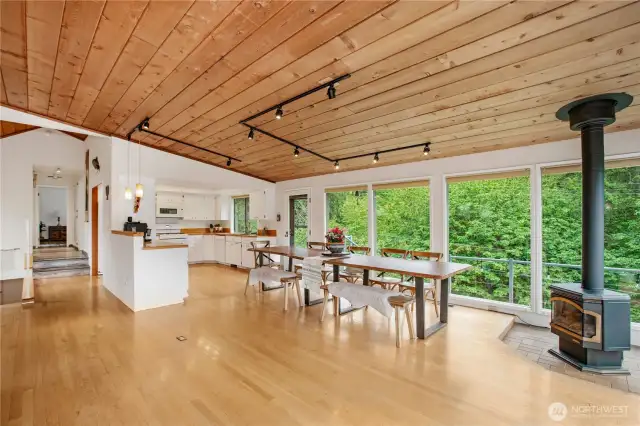 Looking from where the couch is all the windows look out to the beautiful trees and lets in so much natural light.