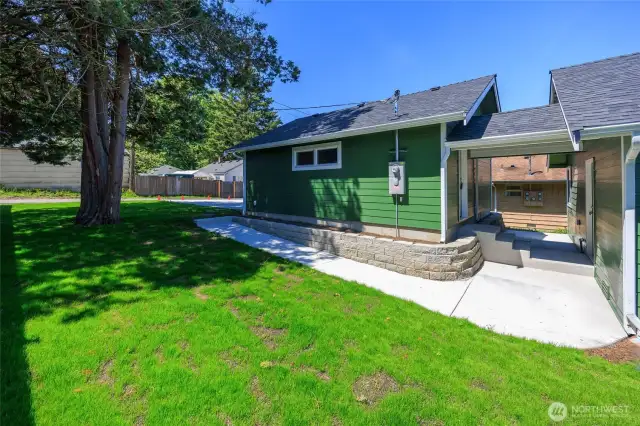 Oversized two-car garage offering a covered breezeway to the home.