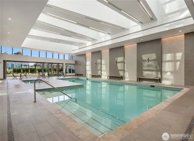 Elegant lap pool with skylights and Jacuzzi