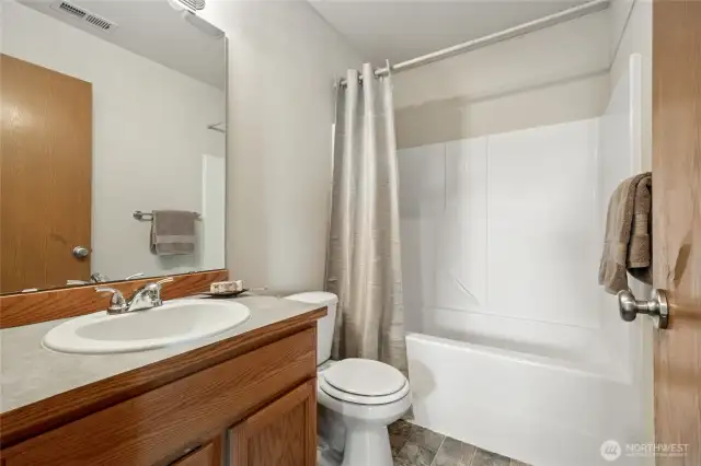 Clean and classic hall bath.