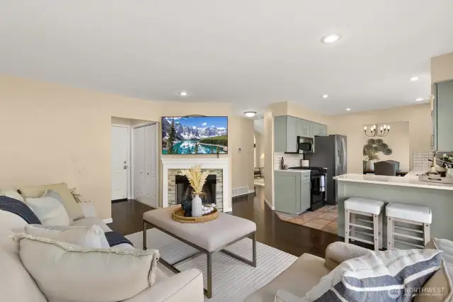 Great circular floor plan allows for easy flow. Door down hall to left is garage access.