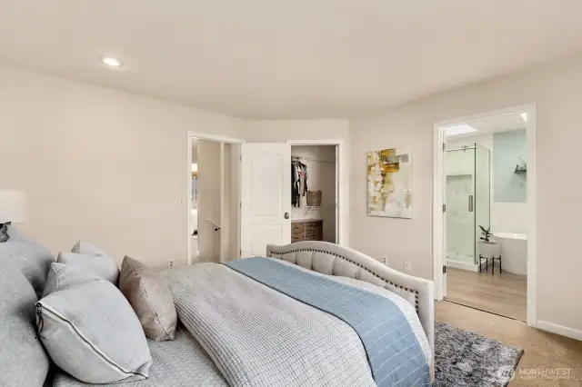Another view of primary, looking to ensuite and walk in closet.