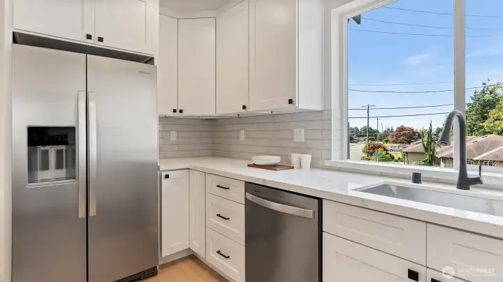 Stainless appliances include the fridge.