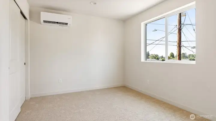 Another bedroom with mini split for comfort and upgraded carpet.