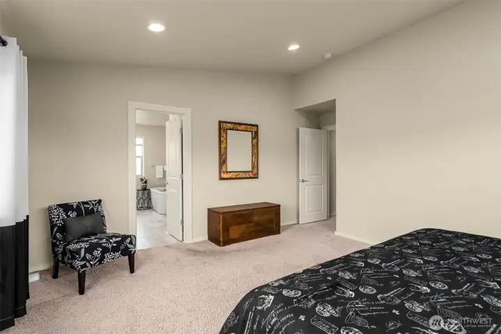 Primary suite features a large bath and walk in closet