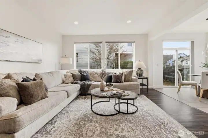 Spacious living room that offers an open concept to the kitchen and breakfast nook.