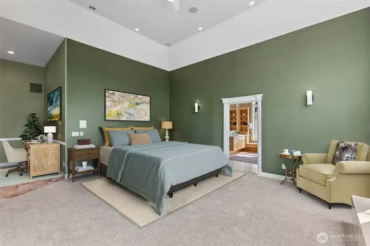 Primary suite highlighted by soaring vaulted ceilings...