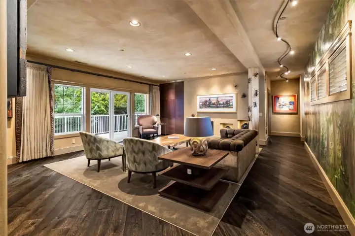 Warm, inviting, and thoughtfully designed, the living space blends custom finishes with everyday comfort, highlighted by rich engineered hardwood flooring, tailored linen drapery, and seamless access to the back deck.