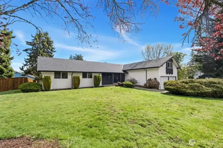 This beautiful sprawling rambler boasts flexible spaces and large yard