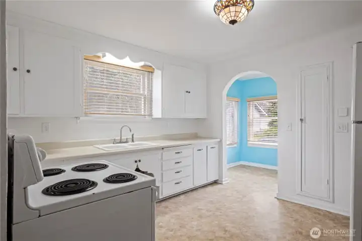 Kitchen wih view to small dining area.