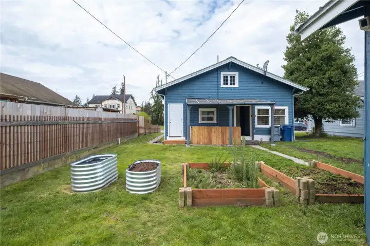 Large garden plot with strawberry & Rosemary already planted.