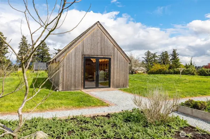Garden shed complete with power, plumbing.