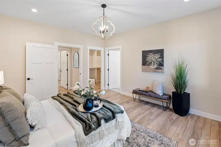 Primary bedroom with bath and walk-in closet