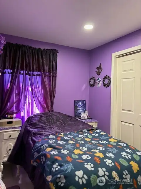 Bedroom #1 is on the main level next to the bathroom.  It has new flooring, new closet doors and new paint.