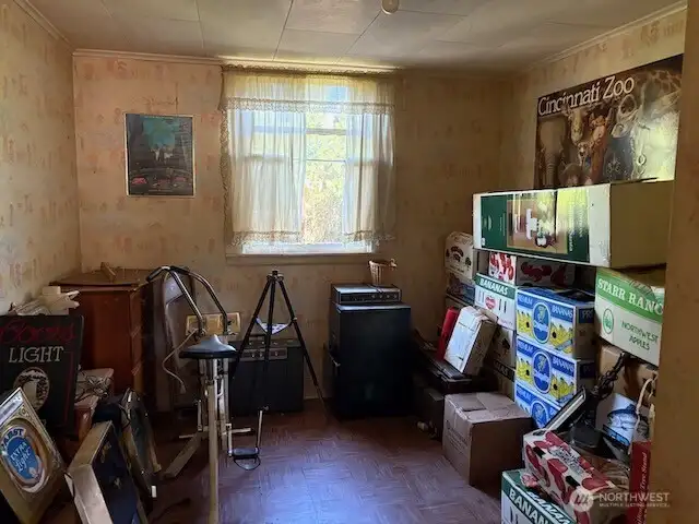 This open area is at the top of the stairs between two bedrooms.  Would be a great place to add a second bathroom.