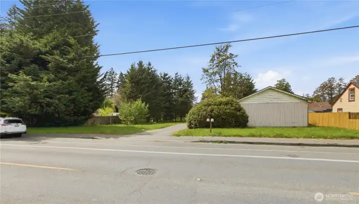 This is the view from across the street where you can see the homes on the right side and the vacant lot on the left.