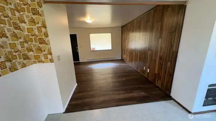 Unit 523: This is the view from the kitchen looking into the dining room and living room. Newer flooring too!