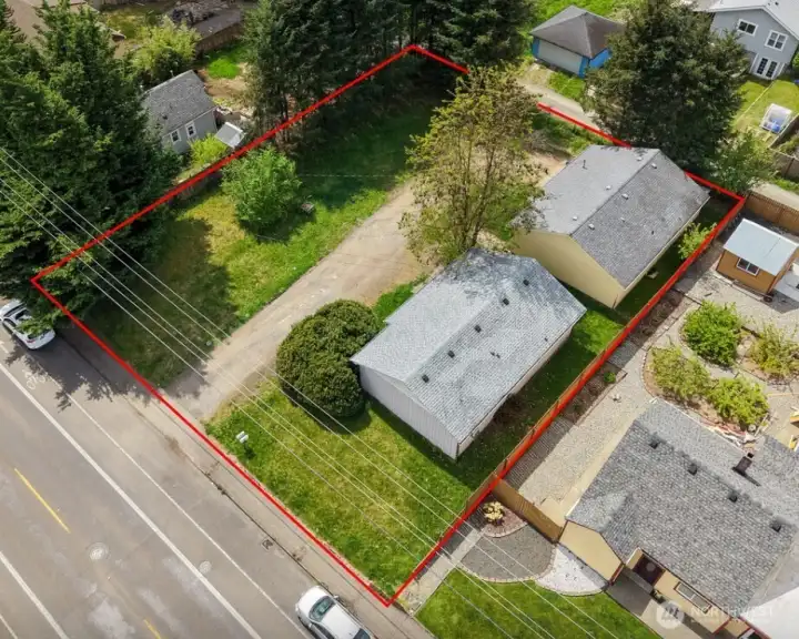 Another aerial view angle of the two properties and adjacent lot.