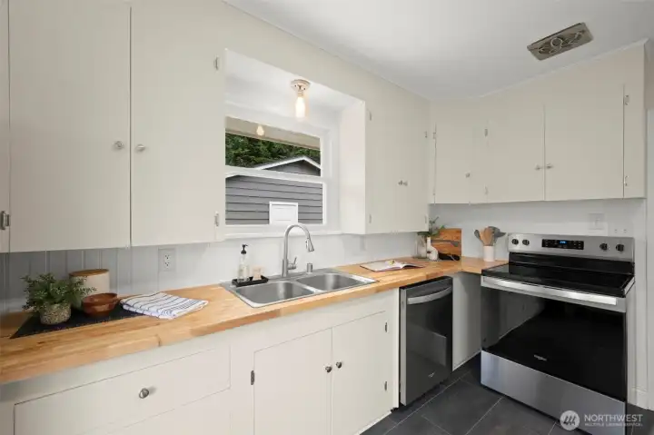 Kitchen with Fresh New Paint, Backsplash and Countertops Kitchen with Fresh New Paint, Backsplash and Countertops
