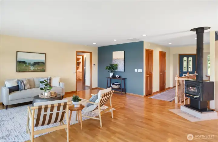 Entry to living room. Doors include 1/2 bath and hall closet.