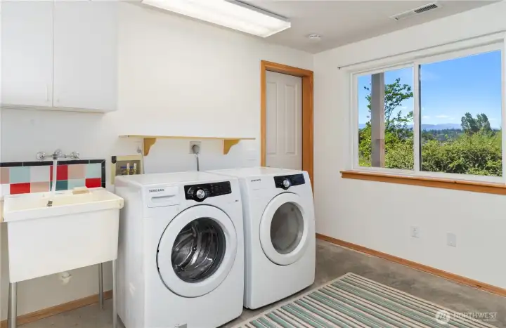 Laundry in daylight basement. Door is to the full bathroom.