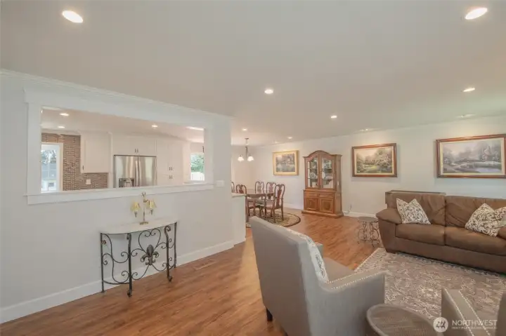 Bright, open living room centered around a beautiful gas fireplace. Bright, open living room centered around a beautiful gas fireplace.