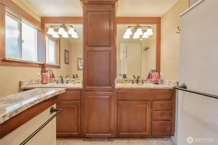 Beautifully remodeled ensuite featuring dual vanities and custom cabinetry Beautifully remodeled ensuite featuring dual vanities and custom cabinetry