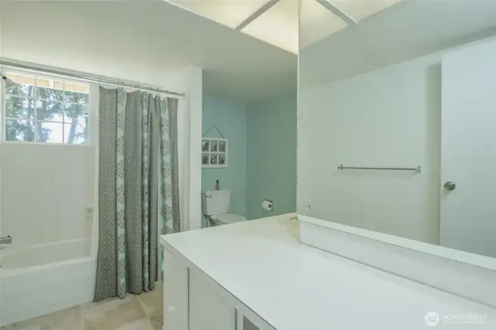 Upstairs full bath with oversized counter and natural light Upstairs full bath with oversized counter and natural light