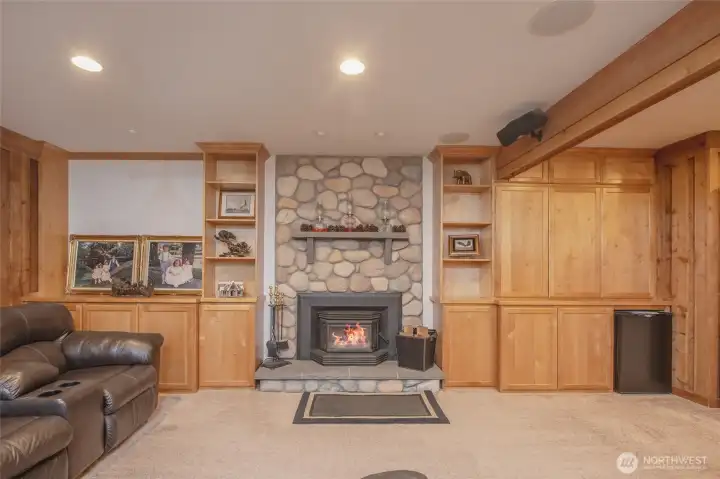 Cozy wood-burning fireplace surrounded by beautiful custom built-ins Cozy wood-burning fireplace surrounded by beautiful custom built-ins