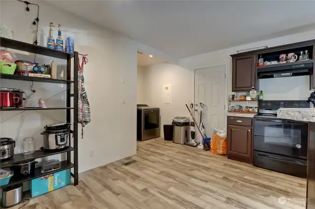 To the left is a great place to put a pantry for more storage. Utility area is to the far back, perfect to enclose with a barn door perhaps? The choice is yours!