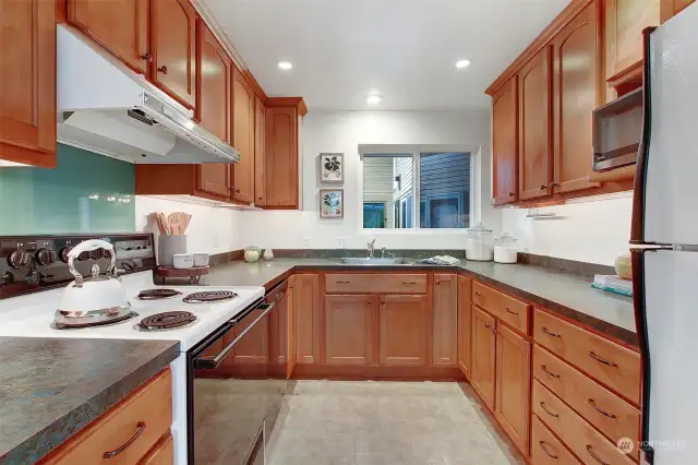 U-shaped kitchen provides ample storage.