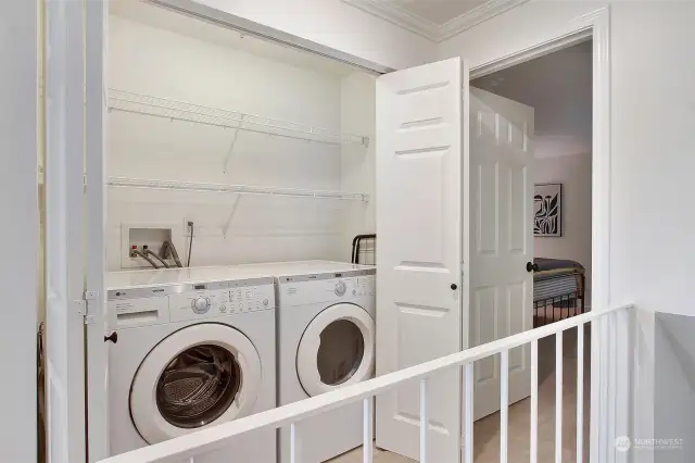 Full size washer and dryer with storage between the two bedrooms.