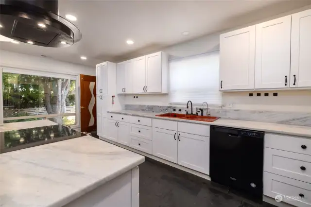 Spacious updated kitchen with granite countertops.