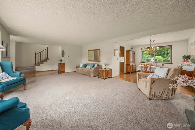 View of dining room, kitchen, entry and stairway from living room. Can you see the potential for entertaining here? And it just keeps going.