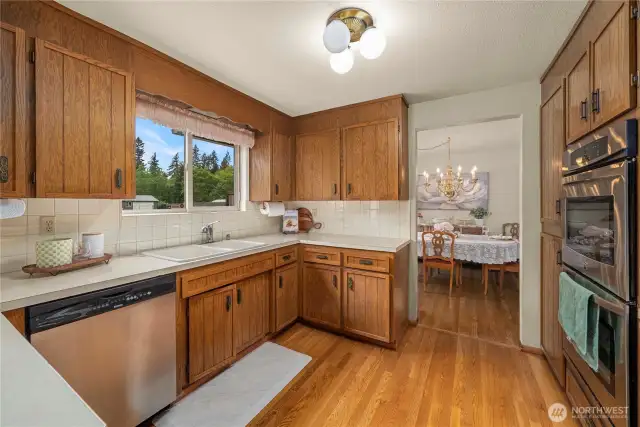 Kitchen with dining room beyond. Imagine spreading out on these expansive counters!