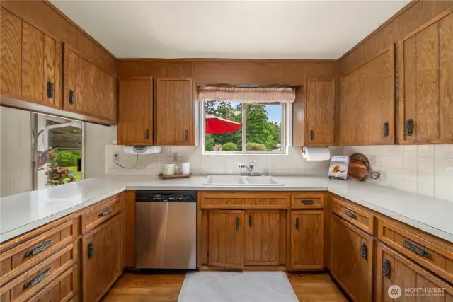 Kitchen with backyard window and sliding door to the back porch