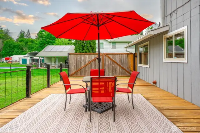 Large uncovered deck with sliding door access to kitchen