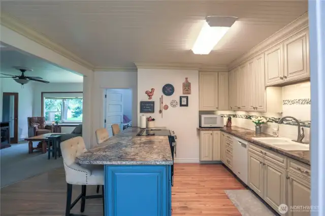 Kitchen view toward the living room.  County charm with modern comfort.