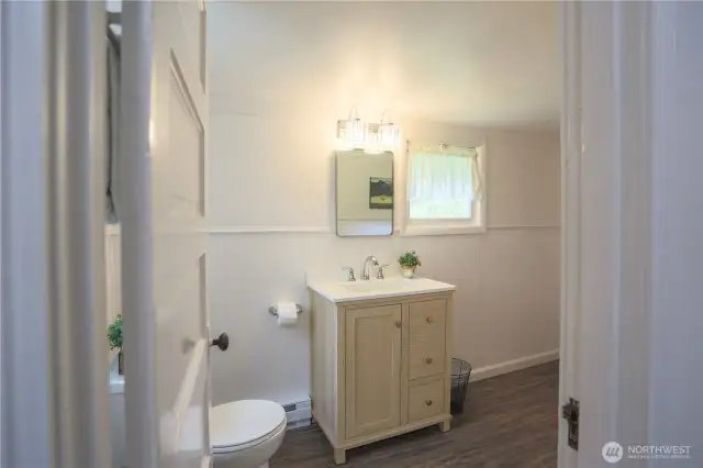 Cute half bath and laundry room off the second bedroom.