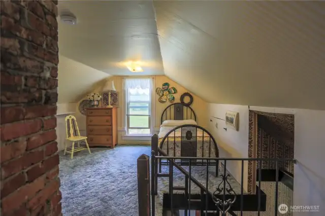 This quaint finished attic space with nostalgic charm is ready to be customized for your home office, playroom, or bonus space.