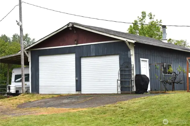 This shop is 28'x 32' with room for RV parking as it has an RV door. There is space in the shop for your tools and toys.