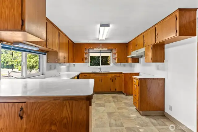 Kitchen has wood cabinets.