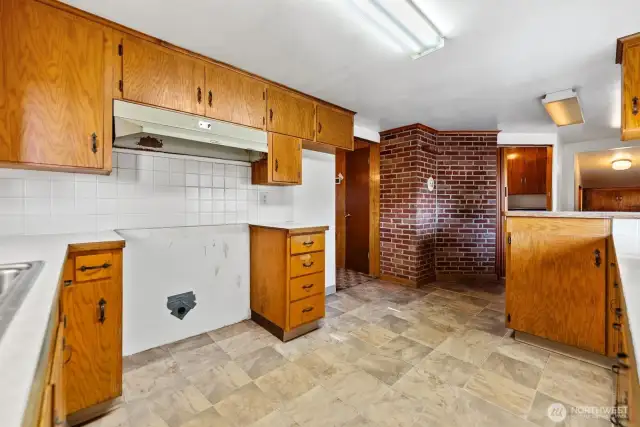 Kitchen area has electric oven/range vent.