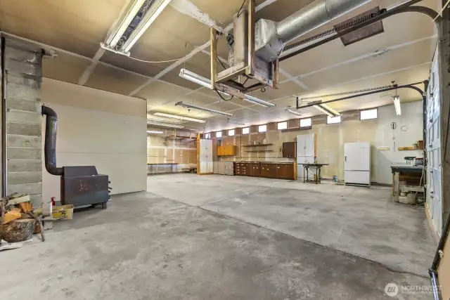 Wood stove in Garage shop area.
