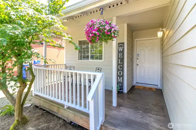 Sweet covered front porch and entry.