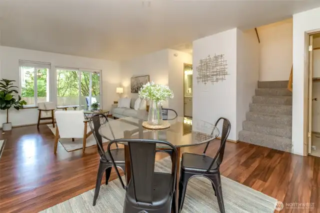 This angle shows the staircase leading to the extra bedrooms and full bathroom. The half bathroom is off the family room and leads to the primary bedroom , ensuite and walk in closet.