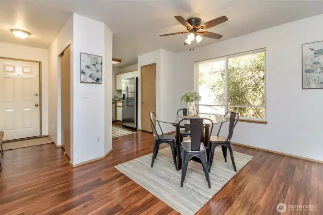 Kitchen has updated stainless steel fridge and dishwasher.