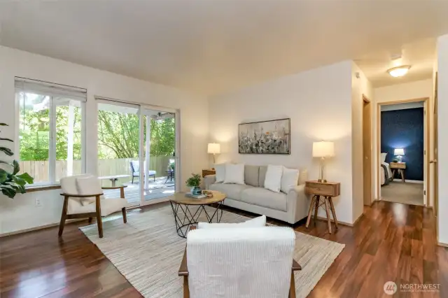 Spacious deck off sliding glass doors with storage shed.