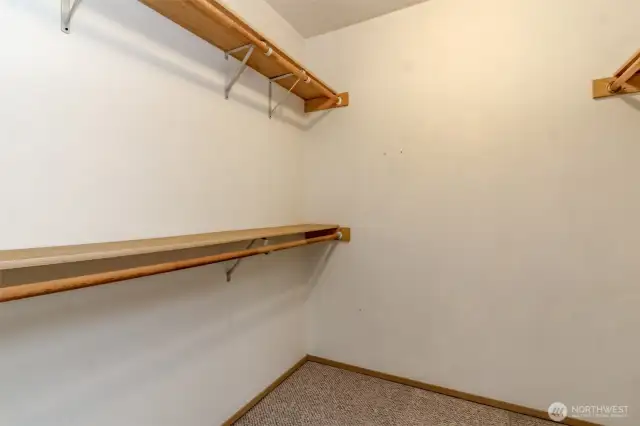 Spacious walk in closet for primary bedroom.